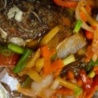 Sweet and Sour Tilapia · Fried whole tilapia topped with a sweet and sour sauce made from carrots, bell peppers, onio...