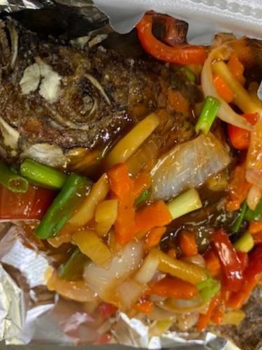 Sweet and Sour Tilapia · Fried whole tilapia topped with a sweet and sour sauce made from carrots, bell peppers, onions, garlic, & ginger.