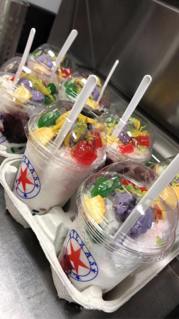 Halo-Halo · Halo-halo is a popular Filipino iced dessert, literally means “mix-mix”.  As its name implies it’s a mixture of boiled sweet beans, preserved or fresh sweet fruits and topped off with shaved ice, evaporated milk, flan & purple yam ice cream.