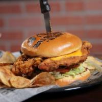 Fried Chicken Sandwich · Homemade fried chicken with melted American and pepper jack  served with lettuce, tomato, an...