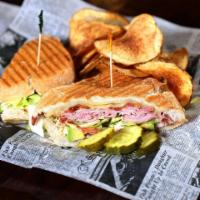 The Club Panini · Fresh sliced turkey, bacon, ham, avocado, lettuce, tomato and mayo with melted pepper jack a...