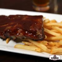 Baked BBQ Baby Back Ribs · Seasoned ribs slow roasted in our signature BBQ sauce and served with french fries.