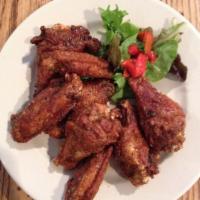 Angela's Wings · A pound of fried wings tossed with lemon juice, honey, garlic, salt and pepper.