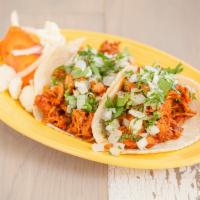 Chicken Tinga · Choice of 2 tacos with onion, cilantro on handmade tortillas, choice of rice and beans or Pe...