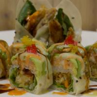 73. Flash-Fried Soft Shell Crab Roll · Whole soft shell crab, lettuce, lobster salad and avocado wrapped with sesame paper.
