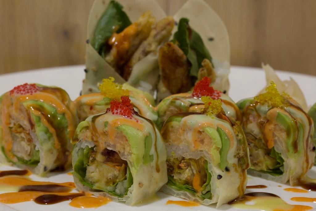 73. Flash-Fried Soft Shell Crab Roll · Whole soft shell crab, lettuce, lobster salad and avocado wrapped with sesame paper.