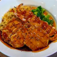 Teriyaki Chicken and Shrimp · Teriyaki glazed chicken and shrimp served with grilled pineapple, Island rice and chef´s cho...