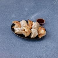 24. Pork Dumplings · 8 pieces. Fried or steamed filled dough.