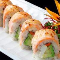 Baked Salmon Roll · In: avocado, crabmeat.
Out: baked salmon.
Sauce: eel sauce.