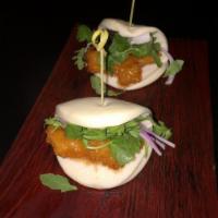 Chicken Buns · Crispy chicken, spring mix, red onions, cilantro, sweet and sour sauce.