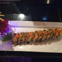 Santa Barbara Roll · Deep-fried tuna, salmon, yellowtail, red snapper wrapped in seaweed, topped with eel sauce a...