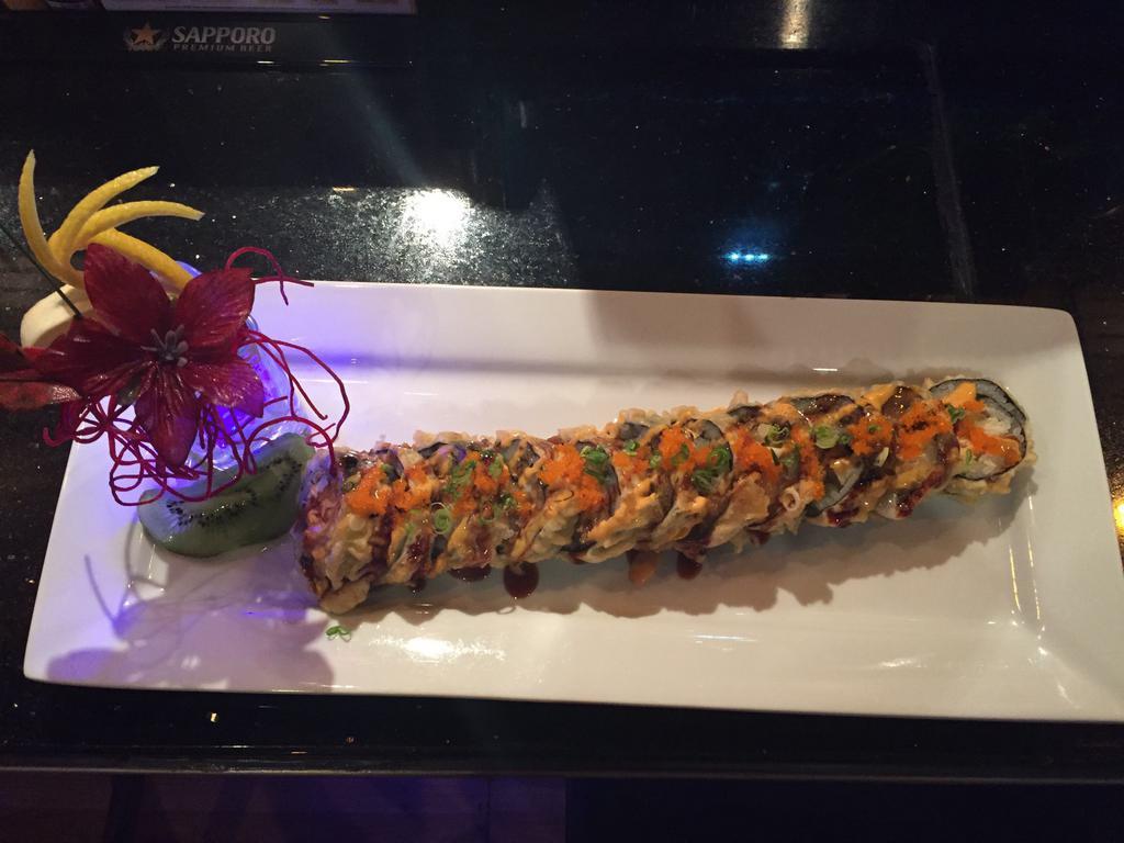 Santa Barbara Roll · Deep-fried tuna, salmon, yellowtail, red snapper wrapped in seaweed, topped with eel sauce and wasabi mayo.(spicy 🌶️)