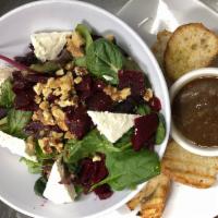 Roasted Beet Salad · Spring mix with feta cheese, walnuts and roasted beets served with balsamic vinaigrette dres...