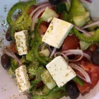 Greek Village Salad · Tomato, cucumber, onions, green peppers, feta cheese, Kalamata olives, oregano and extra vir...