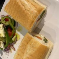 Greek Sandwich · Made with feta cheese, baked zucchini, cucumbers, tomato, oregano and extra virgin olive oil...