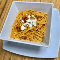 Roasted Red Pepper Vodka Pasta · Goat cheese, sun dried tomatoes, Parmesan cheese and a roasted red pepper vodka cream sauce....