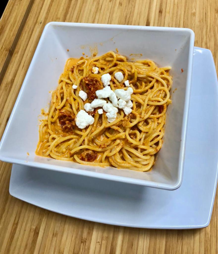 Roasted Red Pepper Vodka Pasta · Goat cheese, sun dried tomatoes, Parmesan cheese and a roasted red pepper vodka cream sauce. Vegetarian.