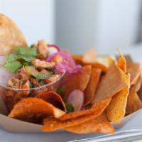 Shrimp Ceviche · Marinated shrimp, tomato, lime, cucumber and tortilla chips.