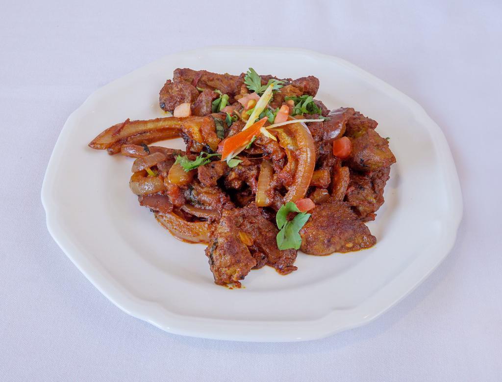 Lamb Sekuwa · Tender boneless lamb marinated overnight in Himalayan spices then pan fried.