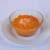 Gajar Ka Halwa · Grated fresh carrots cooked gently in milk and sugar garnish with shredded coconut.