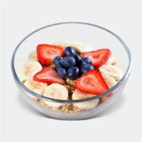 PH Greek Yogurt · Greek yogurt topped with strawberries, blueberries, banana, granola, and honey.