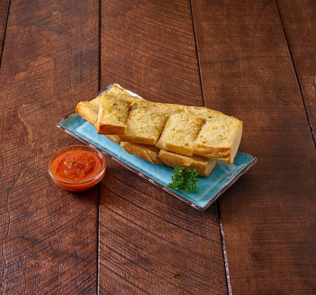 Garlic Bread · Buttery bread that is topped with garlic. Add cheese for an additional charge.