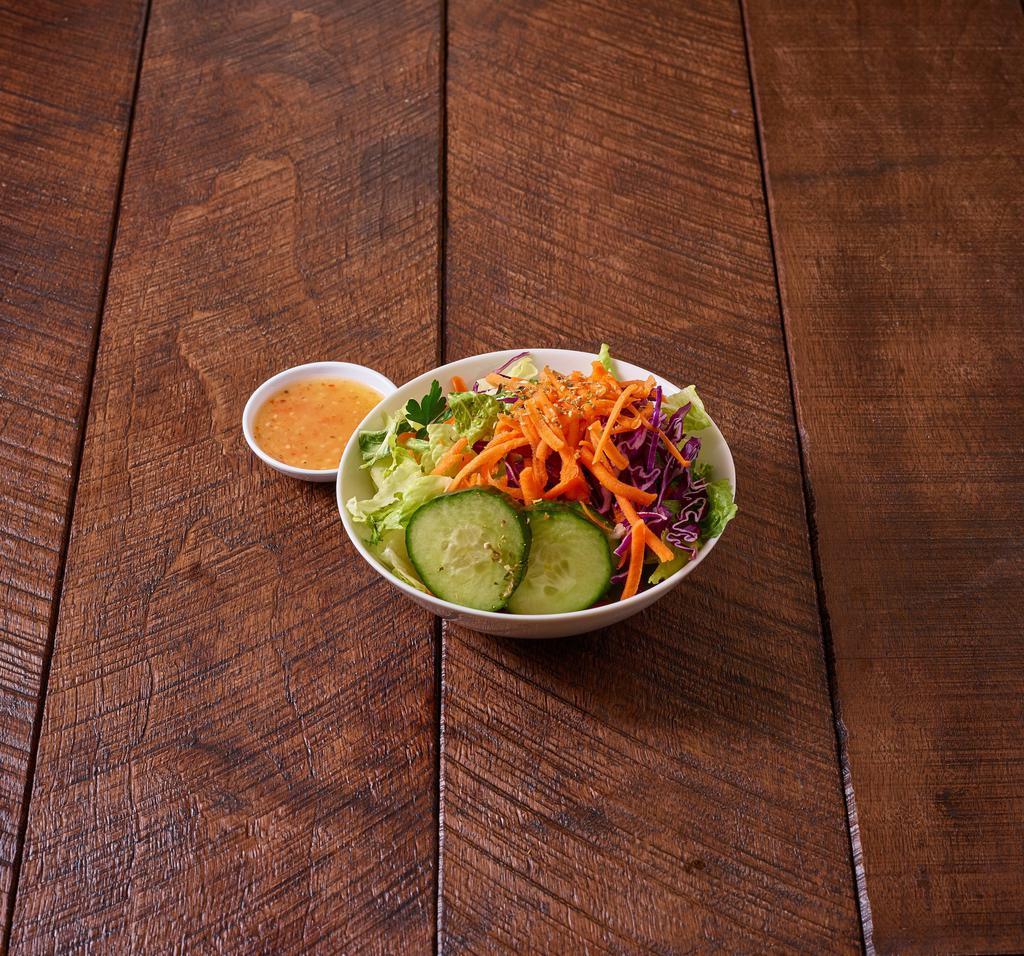 Tossed Green Salad · Romaine lettuce, carrots, red cabbage, cucumber and tomatoes.
