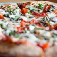 Veggie Pizza · Your choice of garlic sauce or tomato sauce, with mushrooms, onions, green peppers, green an...