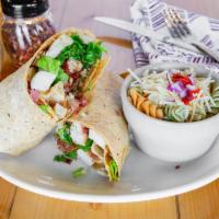 Chicken Caesar Wrap · Grilled chicken, romaine lettuce, shredded Parmesan rolled into a tomato basil wrap, and our...