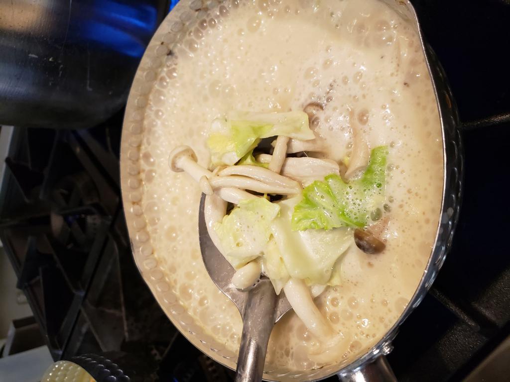 Tom Kha Soup · Thai coconut soup with coconut milk, galangal, lemongrass, kaffir lime leaves, lime juice, fish sauce, mushrooms and cabbage.