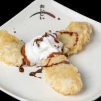 Fried Banana · Served with whip cream and chocolate syrup.