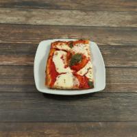 Grandma Pizza · Tomato sauce, basil, fresh mozzarella and shredded mozzarella. Thin crust square pizza.
