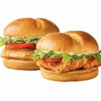 Classic Chicken Sandwich · Lightly seasoned and breaded 100% all white meat chicken breast topped with fresh lettuce, r...