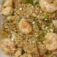 Seafood Fried Rice · Fried rice with lobster meat, crab meat and shrimp sautéed with onions and bell peppers in a...
