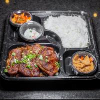 Kalbi Bento Box · Beef Short Rib marinated in our special house sauce served with rice, kimchi and two sides (...