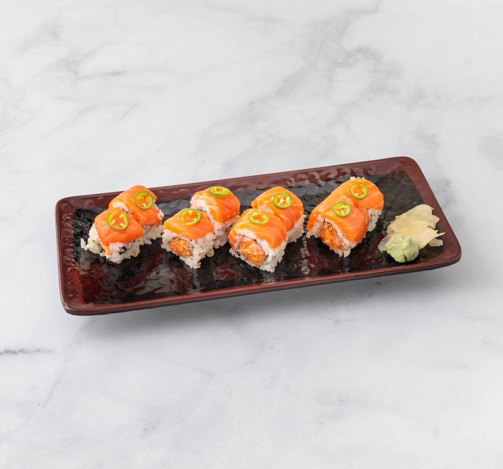 Richmond Roll · Spicy salmon crunch inside, topped with fresh salmon jalapeno. 