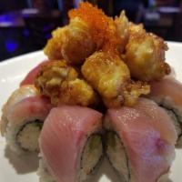 Rainbow Blossom Roll · In: crab meat and avocado. Out: assorted fish, deep-fried lobster, tobiko, eel sauce and spi...