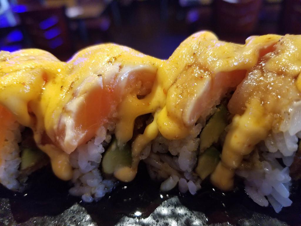 Warriors Roll · In: shrimp tempura, spicy tuna and avocado. Out: salmon, albacore, torch, eel sauce and spicy mayo. Spicy.