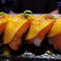 Novia Roll · In: shrimp tempura, cucumber and spicy tuna. Out: salmon, mango and mango sauce. Spicy.