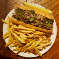 Philly Cheese Steak Sandwich · Sliced ribeye, Swiss, green pepper, grilled onion, mushroom, mayo and classic Philly roll.