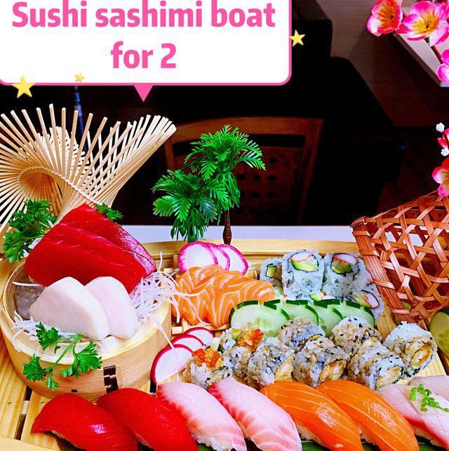 Sushi Sashimi Boat for 2 · Chef's choice of 8 pieces sushi, 8 pieces of sashimi, California roll and shrimp tempura roll.