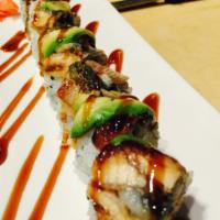 Black Dragon Roll · Shrimp tempura, cucumber topped with eel, avocado and eel sauce.