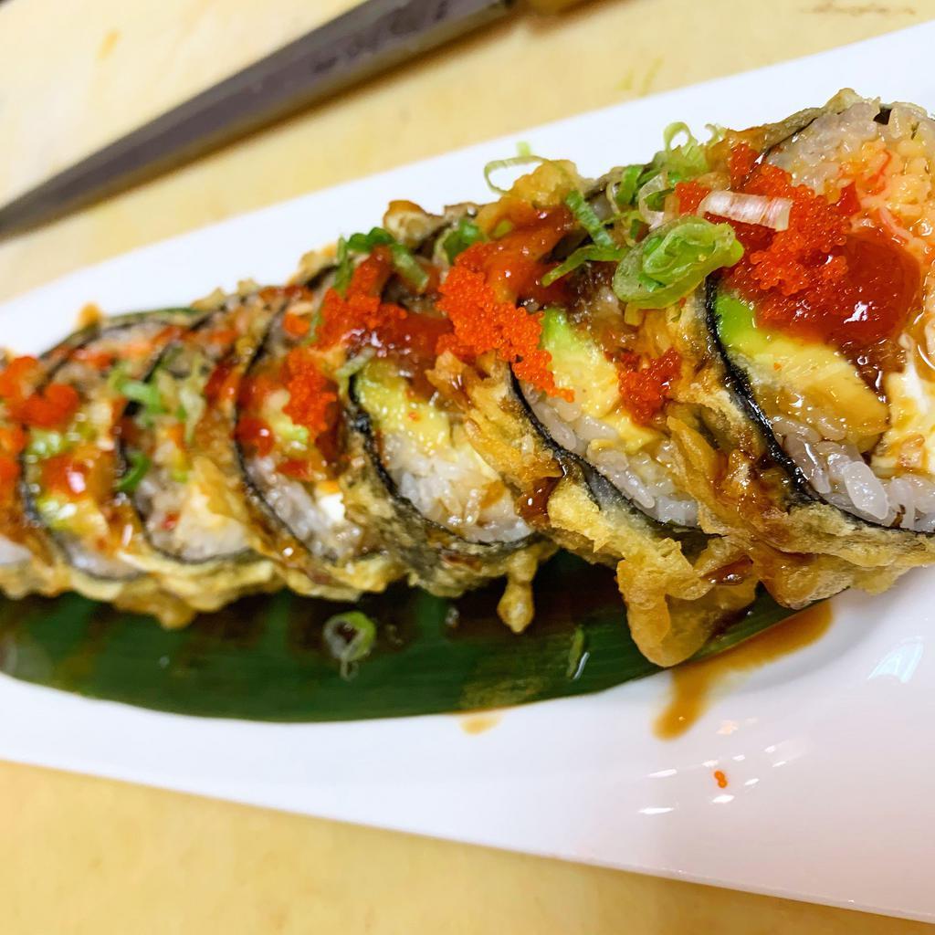 Dinosaur Roll · Fried. Spicy krab, avocado, cucumber, cream cheese, topped with eel sauce, sweet chili sauce, Sriracha, fish eggs and green onion.