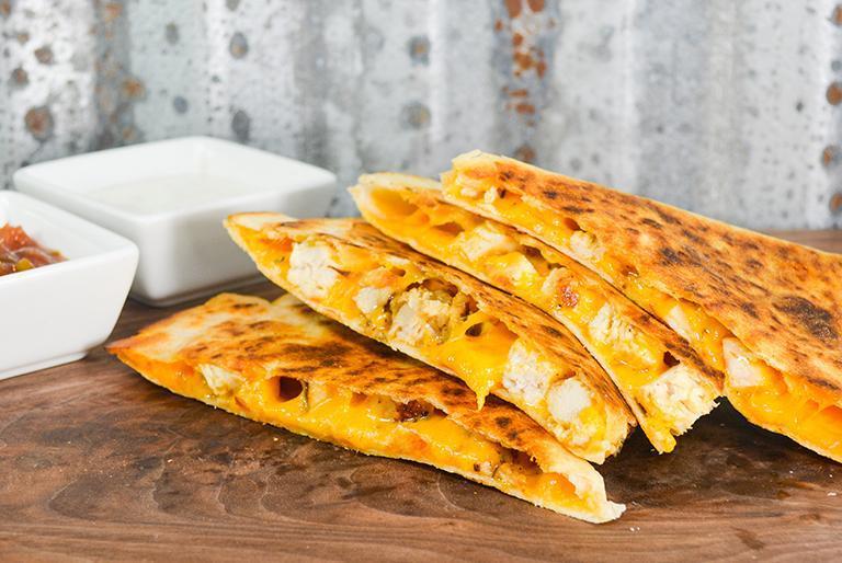 Homemade Quesadilla · Grilled tortilla and cheddar cheese. Choose plain, grilled chicken or philly style steak (at an additional charge). Served with a side of salsa or sour cream.