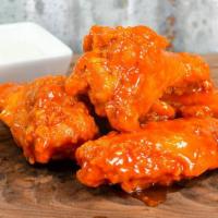 Bone-In Wings · Includes your choice of wing sauce: honey BBQ, mild, hot or sweet Thai chili.