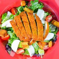 Buffalo Chicken Salad · Homemade breaded chicken, croutons, fresh Buffalo mozzarella and cherry tomatoes on a bed of...