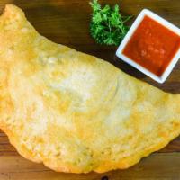 Pizza Turnover · Mozzarella cheese and pizza sauce inside. Traditionally fried, ask for baked if desired.