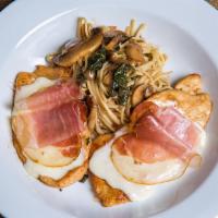 Chicken Saltimbocca · Pan seared and topped with prosciutto, spinach and mozzarella, served over linguini in a sag...
