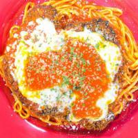 Chicken Parmigiana · Breaded and fried, topped with melted mozzarella and homemade tomato sauce, served with spag...