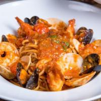 Linguini Pescatore · Sauteed mussels, clams and shrimp in a fresh cherry tomato sauce marinara over linguini.